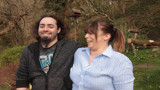 Kyeron and his Shared Lives carer, Lyn, smiling at the camera.