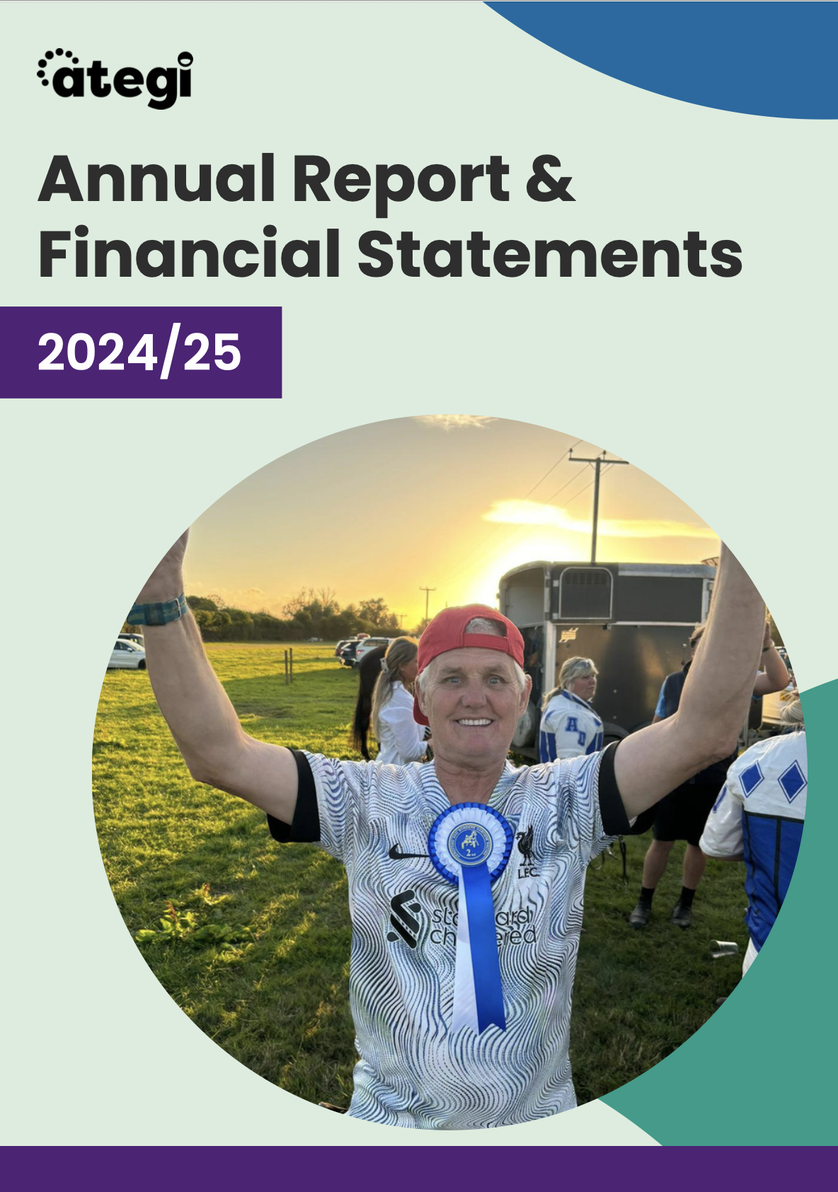 Front cover of Ategi's annual report. It has the picture of a person we support looking happy with his arms in the air.